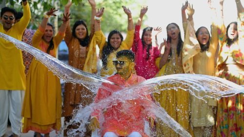 water splash on the Groom during the haldi ceremony